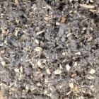 Mulch and wood chips for sustainable garden ground cover solutions.