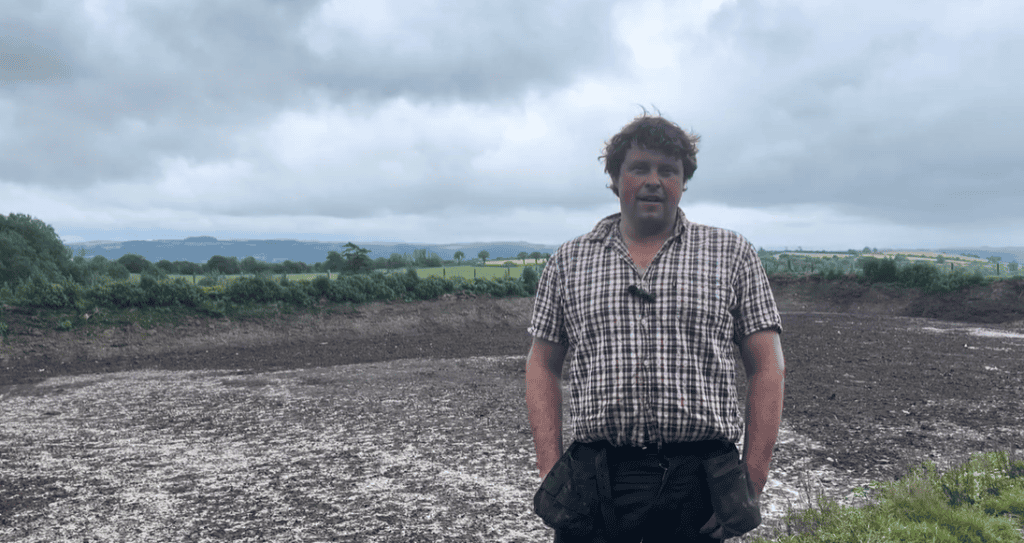 Welsh farmer using EnviroSystems slurry management solutions in a field.
