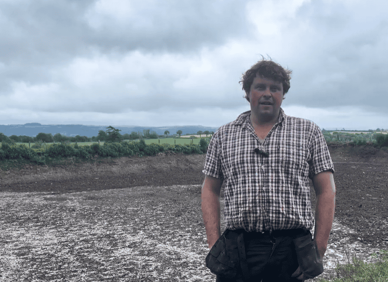 Welsh farmer using EnviroSystems slurry management solutions in a field.