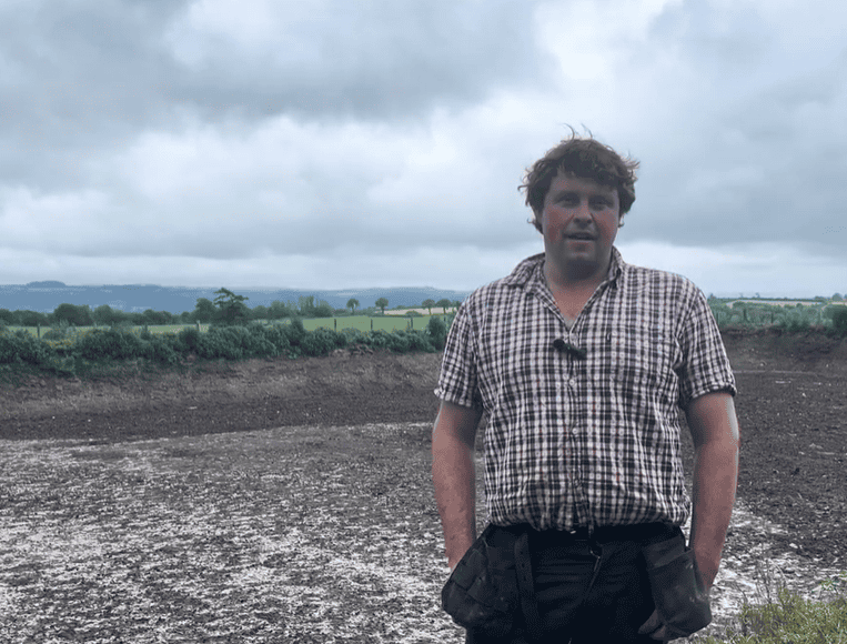 Welsh farmer using EnviroSystems slurry management solutions in a field.