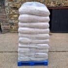 Pallet of StableBoost horse bedding bags for clean, comfortable stabling.